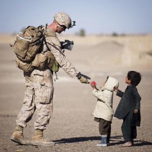 Soldier Helping Children