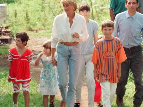 Diana with a family in Bosnia