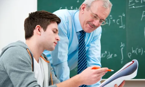 Professor helping student